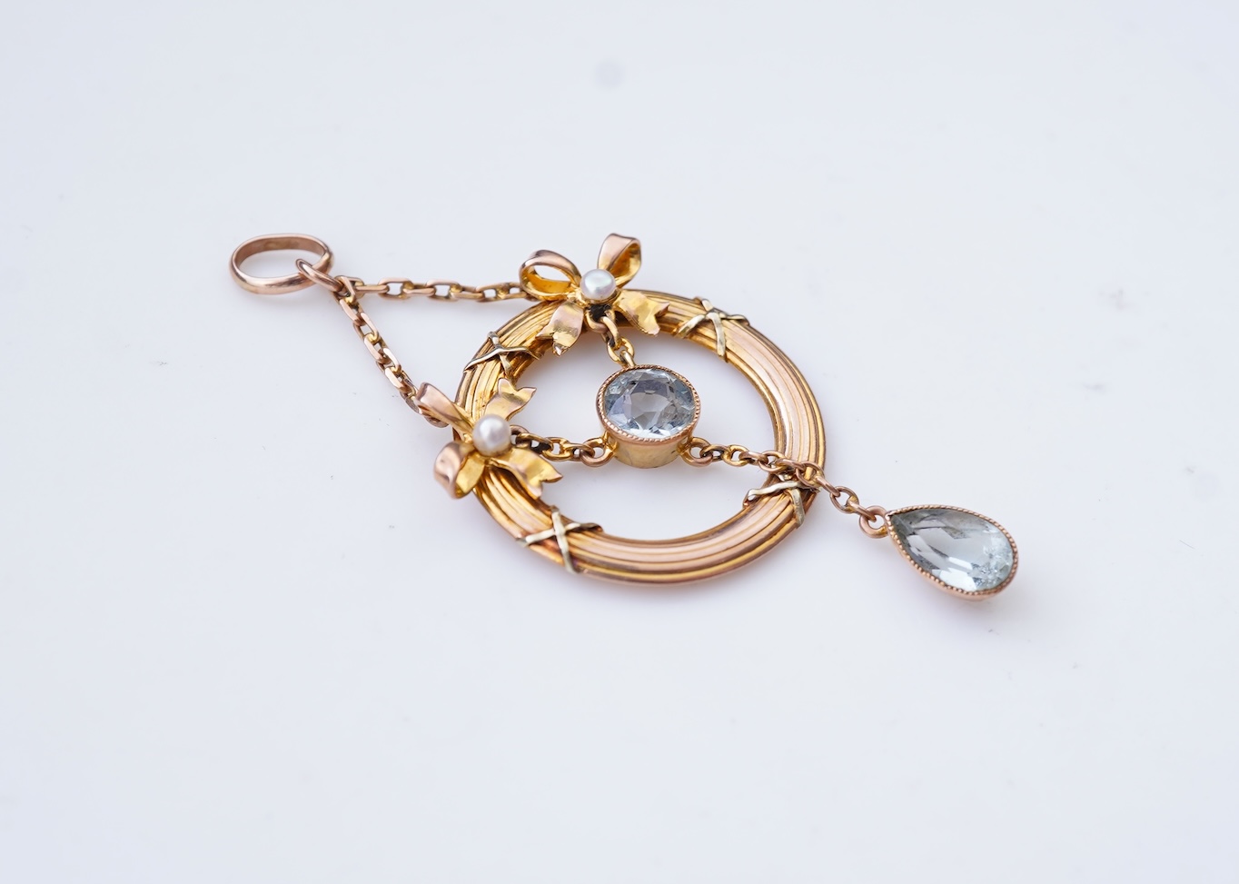 An Edwardian seed pearl and aquamarine pendant, circa 1910